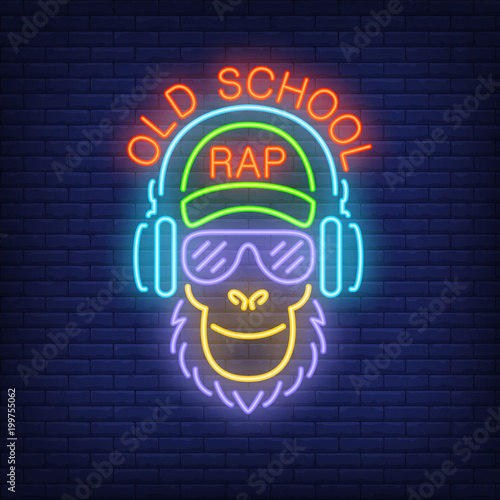 Old school rap neon text and cool monkey in glasses and headphones. Neon sign, night bright advertisement, colorful signboard, light banner. Vector illustration in neon style.