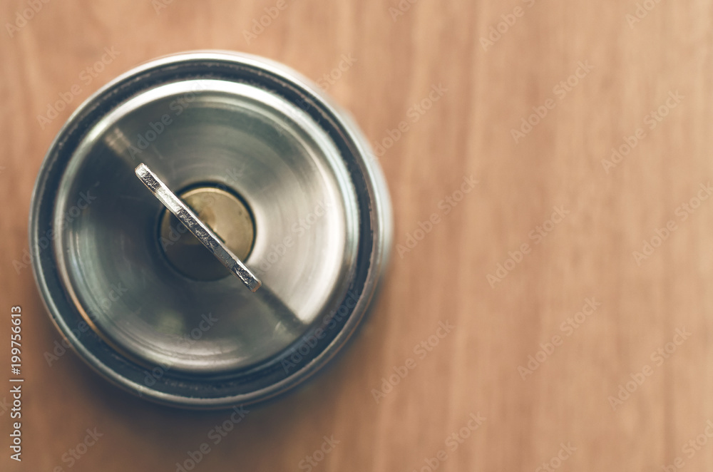 Key in the door lock. Doorknob with key on wooden background with copy space. Key in the door lock. Doorknob with key on wooden background with copy space.