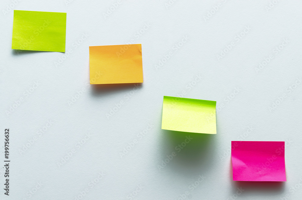 Blank sticker label isolated on the white wall surface background with copy space. To do list. Plans. Blank sticker label isolated on the white wall surface background with copy space. To do list. Plans.