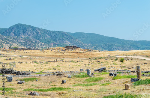 ruins, remains in the field in the background of the hills of the ancient city of Hierapolis