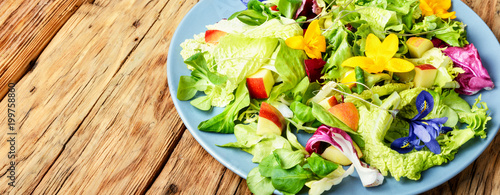 Fresh vegan salad with edible flowers