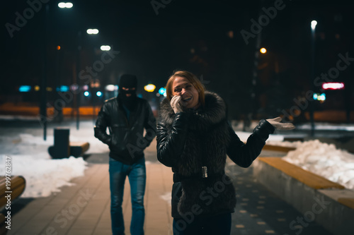 Robber prepearing to attack his victim