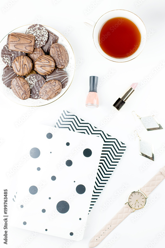 Flat lay home office desk. Feminine workspace with diary, flowers, sweets, fashion accessories. Fashion blogger concept. Flat lay home office desk. Feminine workspace with diary, flowers, sweets, fashion accessories. Fashion blogger concept.