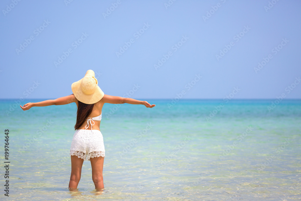 Woman on beach in summer
