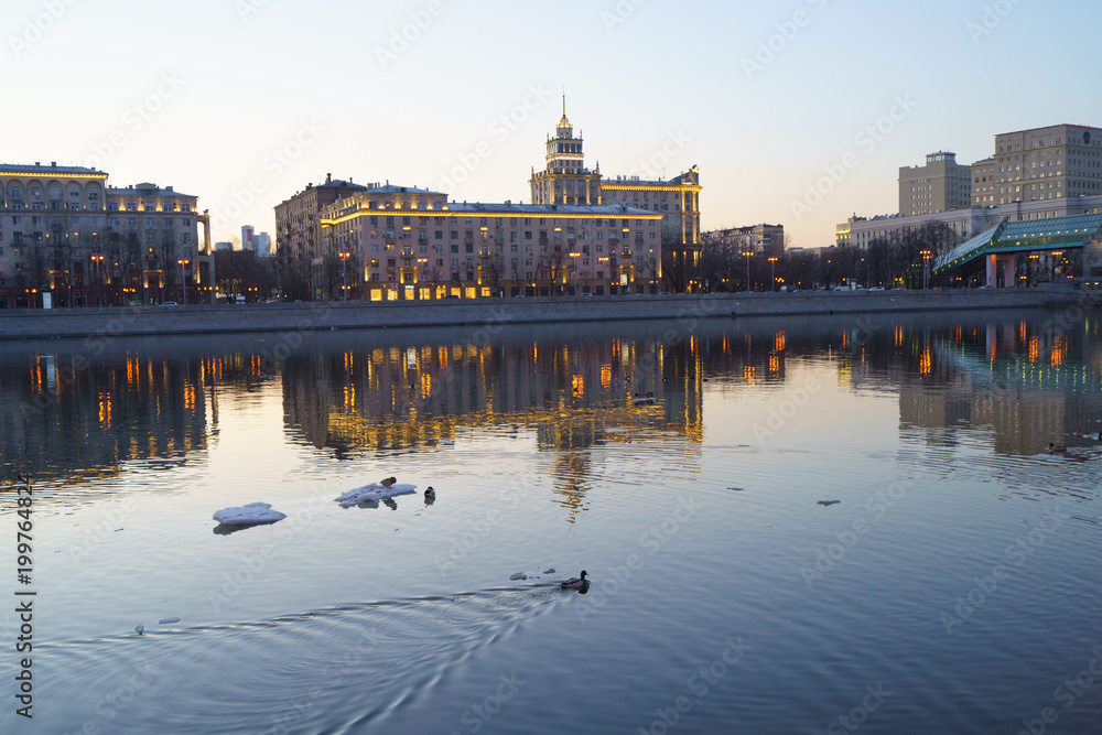 Bright dusk in Moscow, embankment of Moscow river is full of lights and bright colors