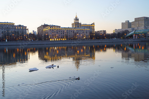 Bright dusk in Moscow, embankment of Moscow river is full of lights and bright colors