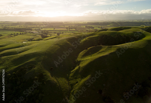 Shadows Cover New Zealand Hills At Sunset In Martinborough 