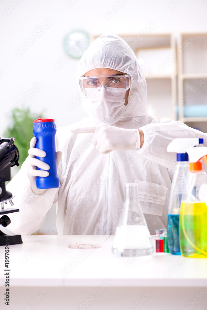 Fototapeta premium Chemist checking the quality of bathroom supplies