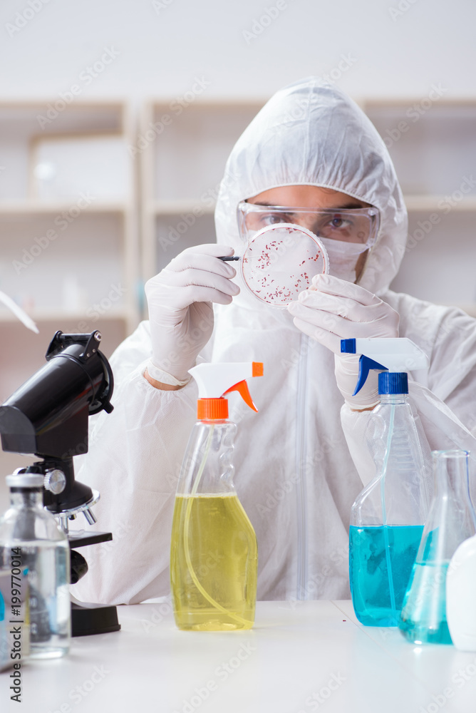 Chemist testing chemical substances in lab Chemist testing chemical substances in lab