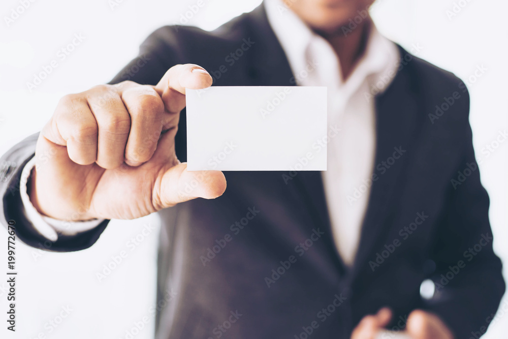 businessman holding and showing empty business card or name card - business concept businessman holding and showing empty business card or name card - business concept