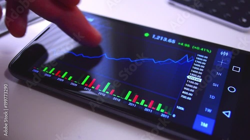 Businessman browse inceasing stock market forex chart in the mobile app. Smartphone screen close up shot.