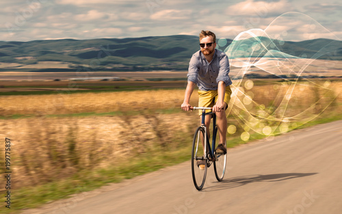 Gorgeous biker in the nature going somewhere with ethereal concept