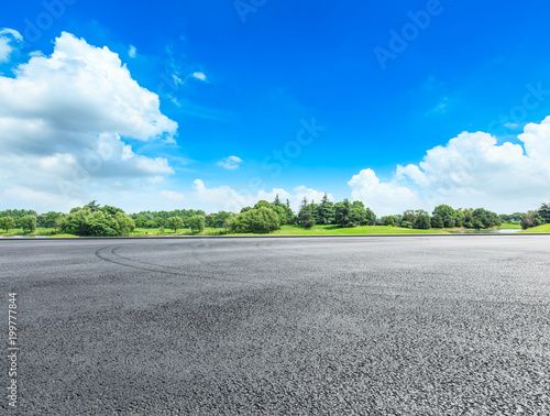 empty asphalt road ground and green forest in summer