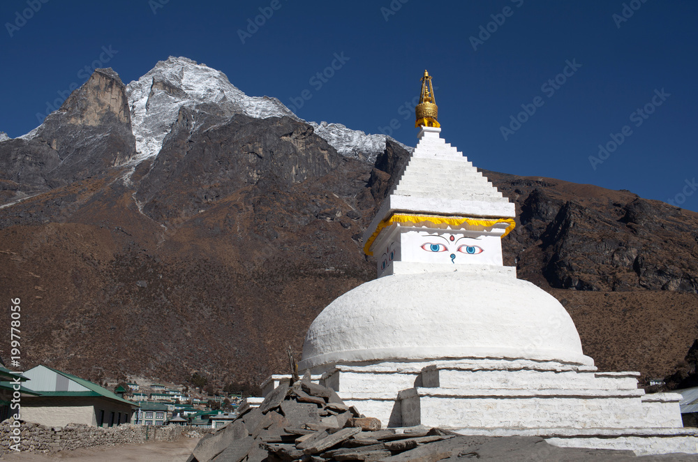 Mount Khumbila and buddhist white stupa near Khumjung village on the way to Everest base camp, Sagarmatha, Nepal Himalayas