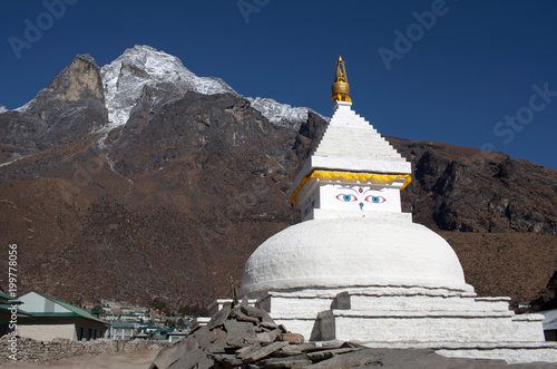 Mount Khumbila and buddhist white stupa near Khumjung village on the way to Everest base camp, Sagarmatha, Nepal Himalayas