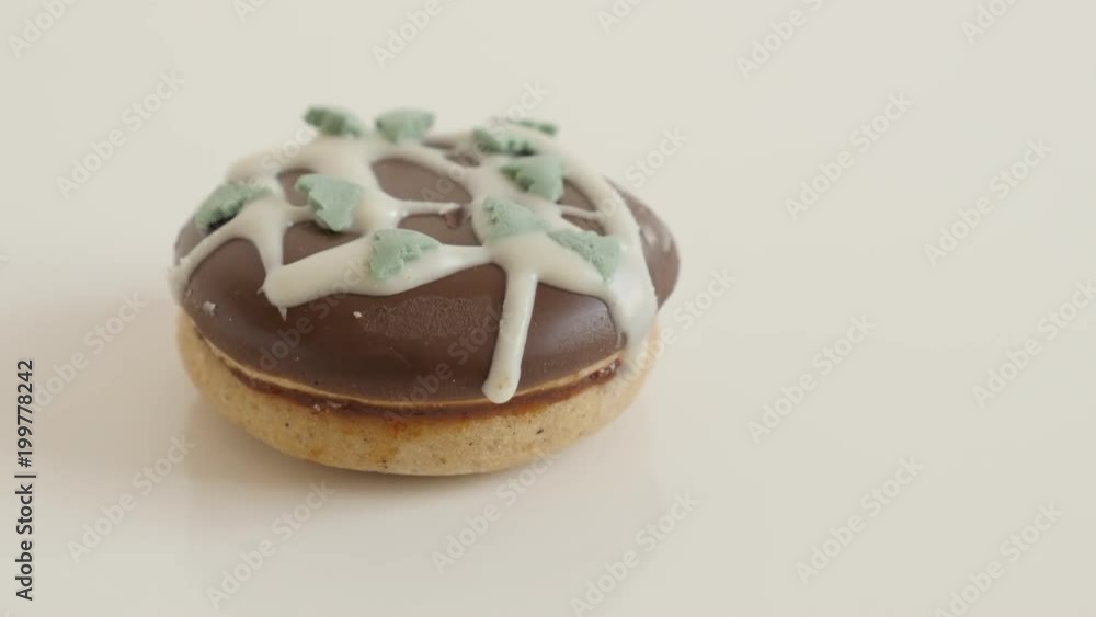 Close-up of colorful sprinkles over the cookie footage - Stuffed teacake slow tilt Close-up of colorful sprinkles over the cookie footage - Stuffed teacake slow tilt