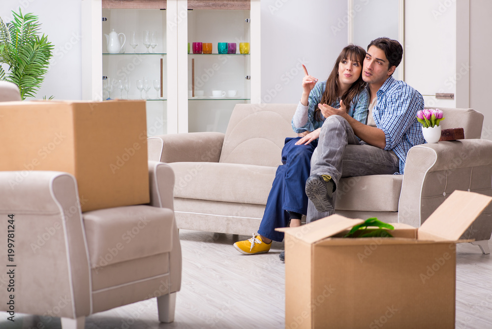 Young family moving in to new apartment after paying off mortgage Young family moving in to new apartment after paying off mortgage