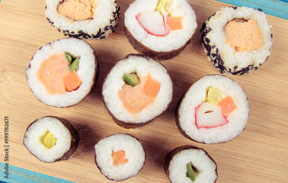 Various kinds of sushi on the blue background. Various kinds of sushi on the blue background.
