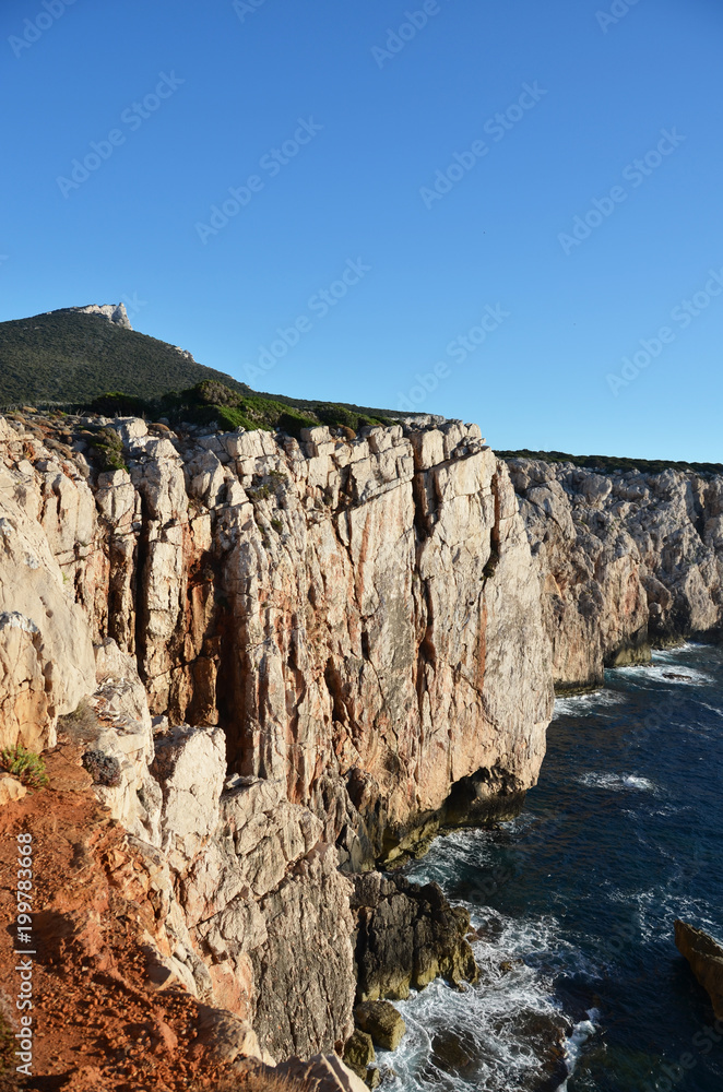 cala barca cliffs at alghero, sardinia, italy