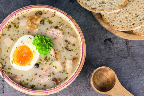 Zurek - polish Easter soup with eggs and white sausage - closeup