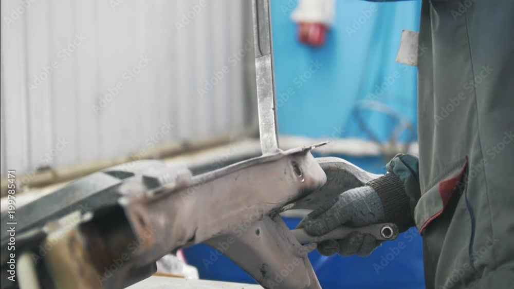 Mechanic man working with autoparts at the service station Mechanic man working with autoparts at the service station