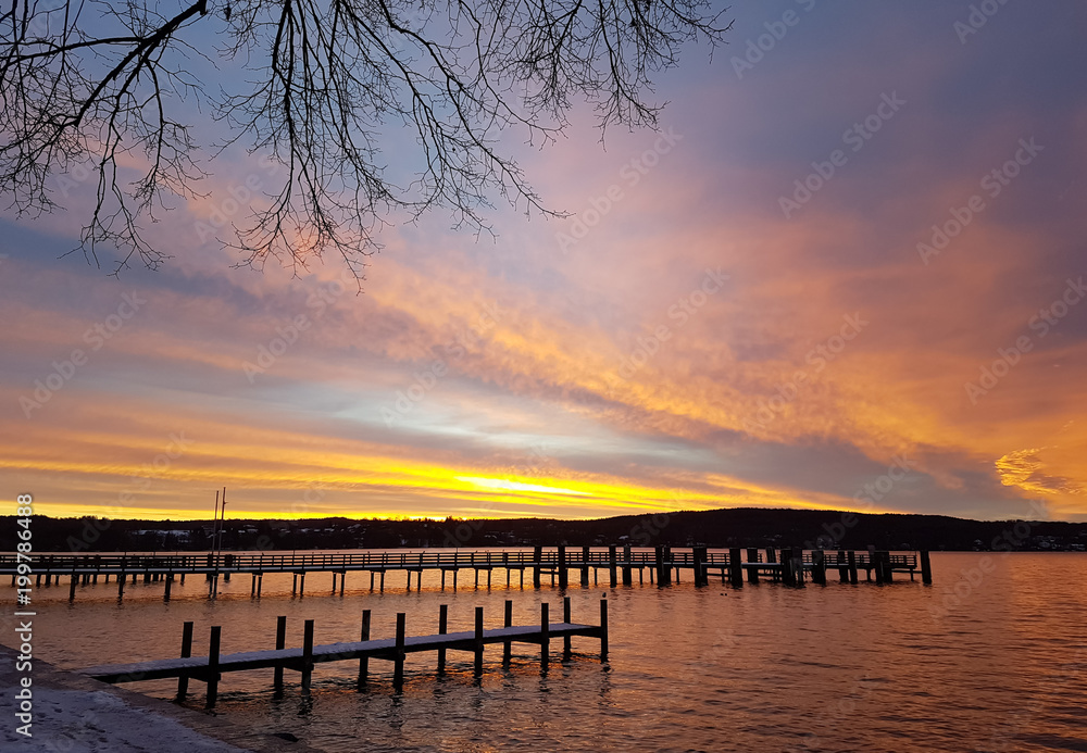 Sunrise behind the pier at Lake Starnberg Sunrise behind the pier at Lake Starnberg