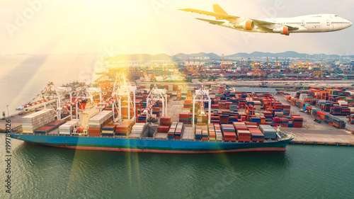 Container ships and transport aircraft in the export and import business and logistics international goods. Shipping cargo to harbor by crane. Aerial view and top view.