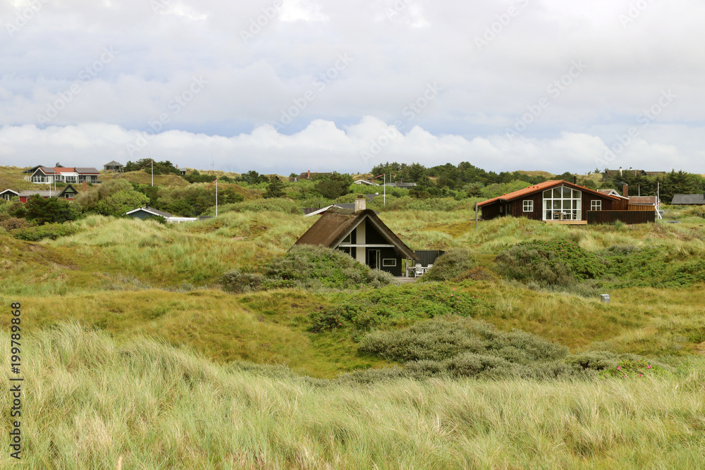Typical scandinavian holiday house in Denmark. Island Fanoe. North Sea. Typical scandinavian holiday house in Denmark. Island Fanoe. North Sea.