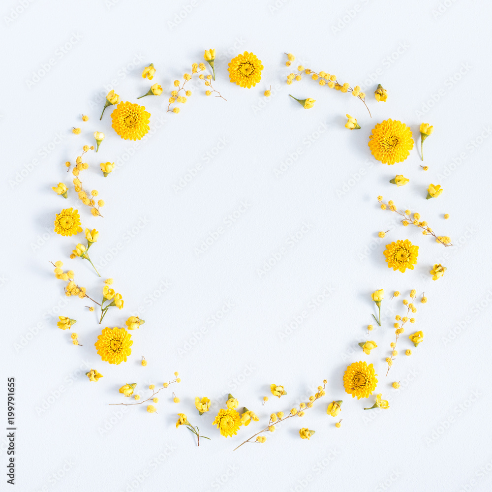 Flowers composition. Wreath made of yellow flowers on pastel blue background. Flat lay, top view, square, copy space