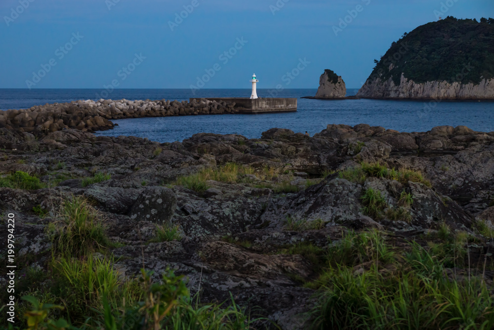 View to Lighthouse during blue hour after sunset at Seaseom, Seogwipo, Jeju Island, South Korea