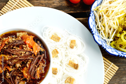 Rice noodles with spicy pork sauce Thai Northern Style (Thai name is Kanomjeen NamNgeaw) photo