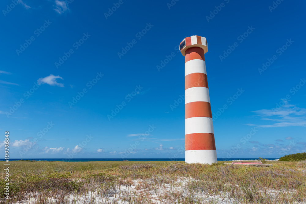 Red and white striped lighthouse at Water Cay, in Los Roques archipelago
