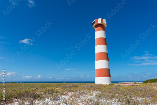 Red and white striped lighthouse at Water Cay  in Los Roques archipelago