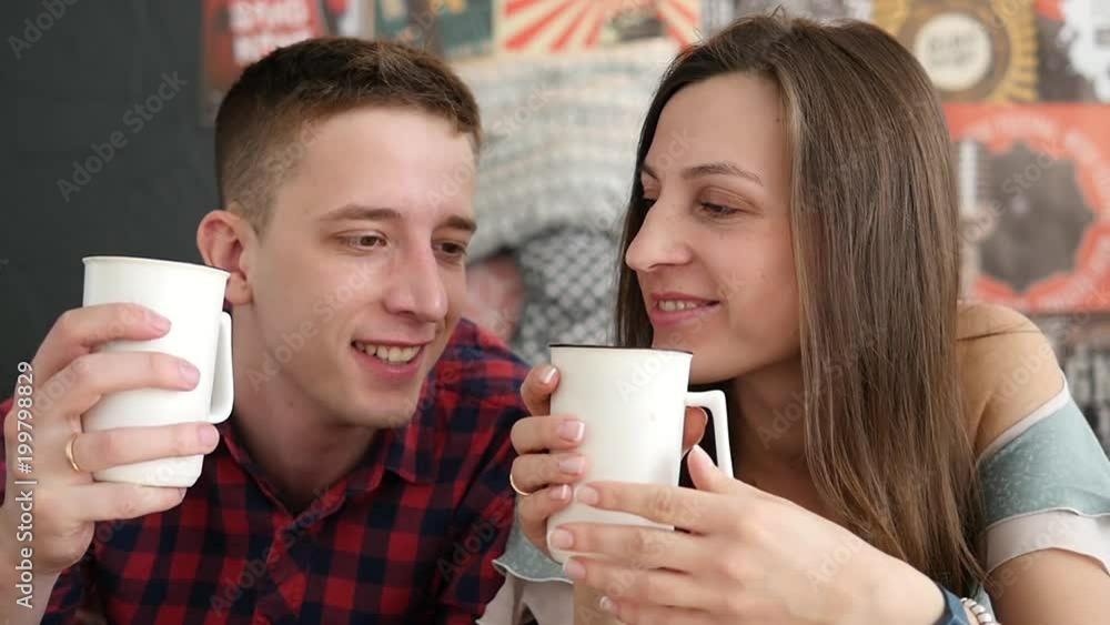 young couple drink coffee in bed, happy smile woman man lovers, love romantic morning slow motion young couple drink coffee in bed, happy smile woman man lovers, love romantic morning slow motion