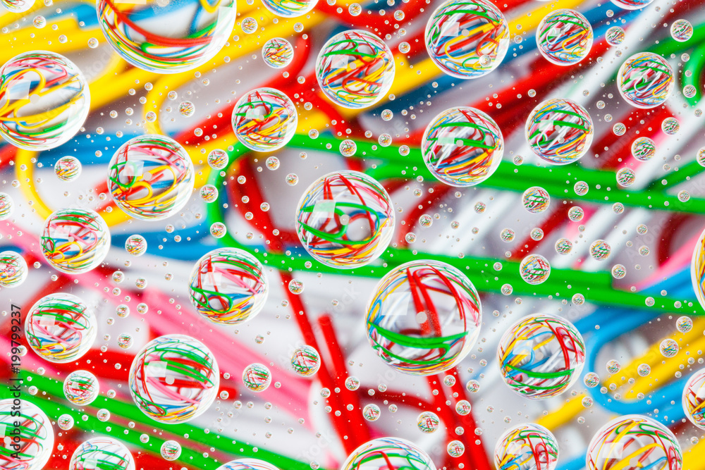 Color background with water drops and paper clips Color background with water drops and paper clips