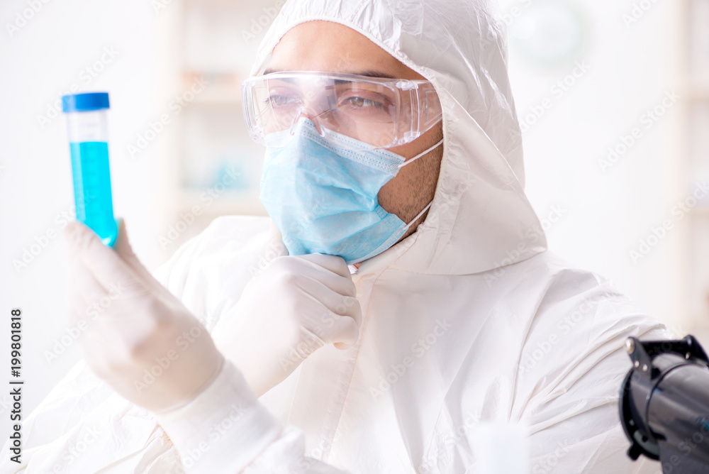 Young chemist student working in lab on chemicals Young chemist student working in lab on chemicals