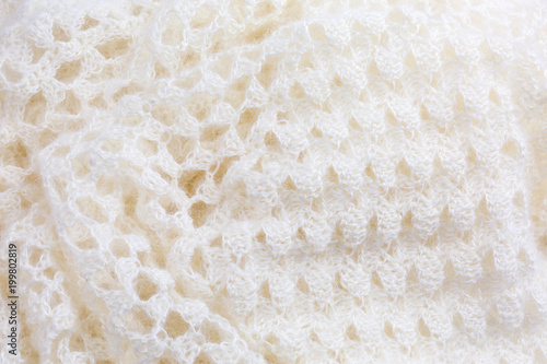background of crocheted shawl in white mohair and silk wool