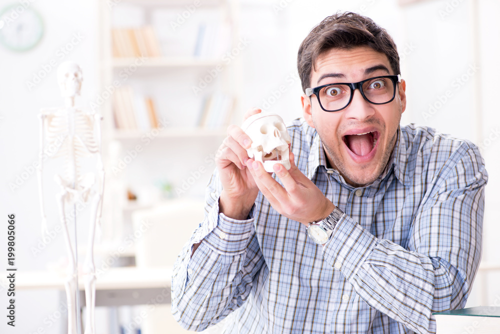 Medical student studing the skeleton