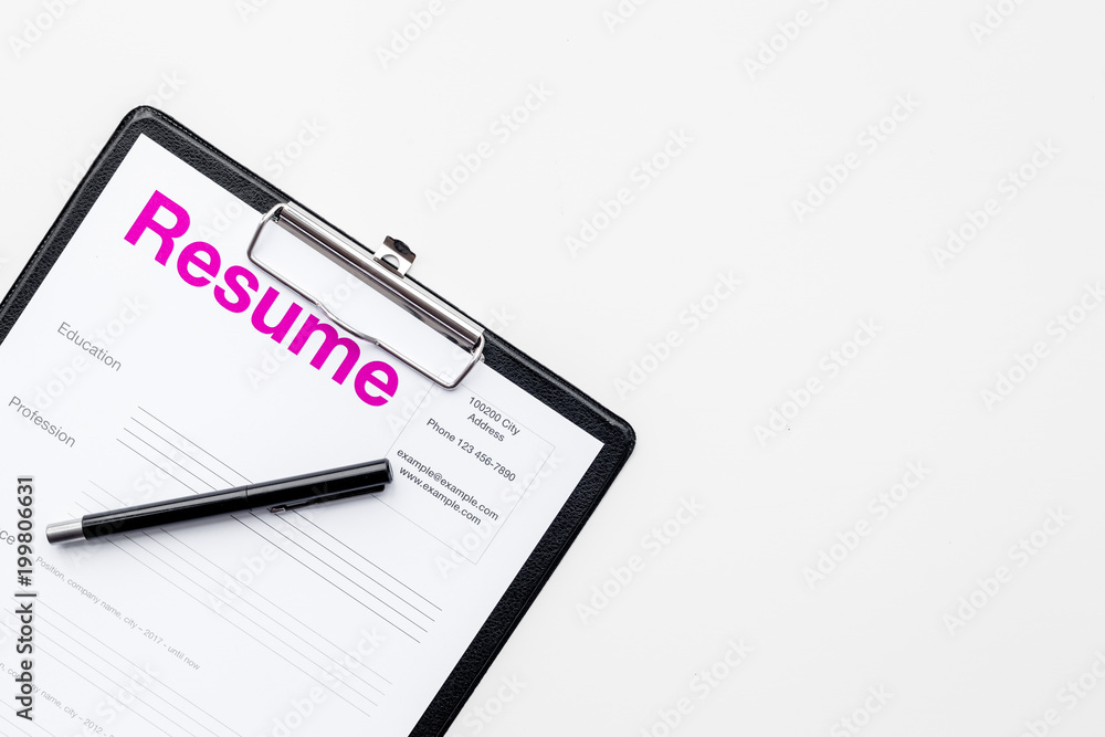 Looking for work concept. Resume on padwith on white background top view space for text Looking for work concept. Resume on padwith on white background top view space for text