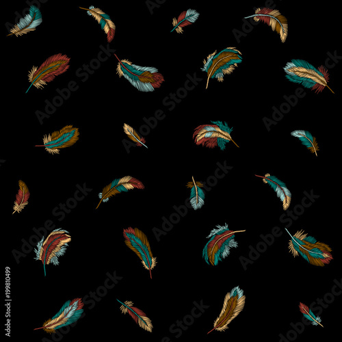 Colorful feathers embroidery seamless pattern. Boho tribal clothes indian bird classic embroidered background. Fashionable template design vector illustration
