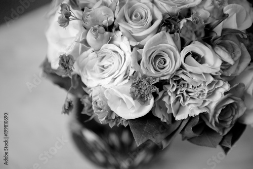 Bouquet of a bride in a vase. Beautiful wedding bouquet. Black and white.