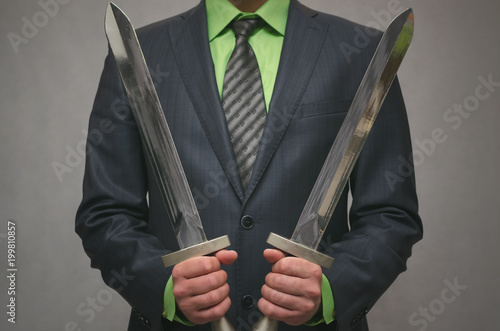 Businessman holds in hand a toy sword weapon. Life or finance insurance agent. Money deposite safety agent. Security agent concept.