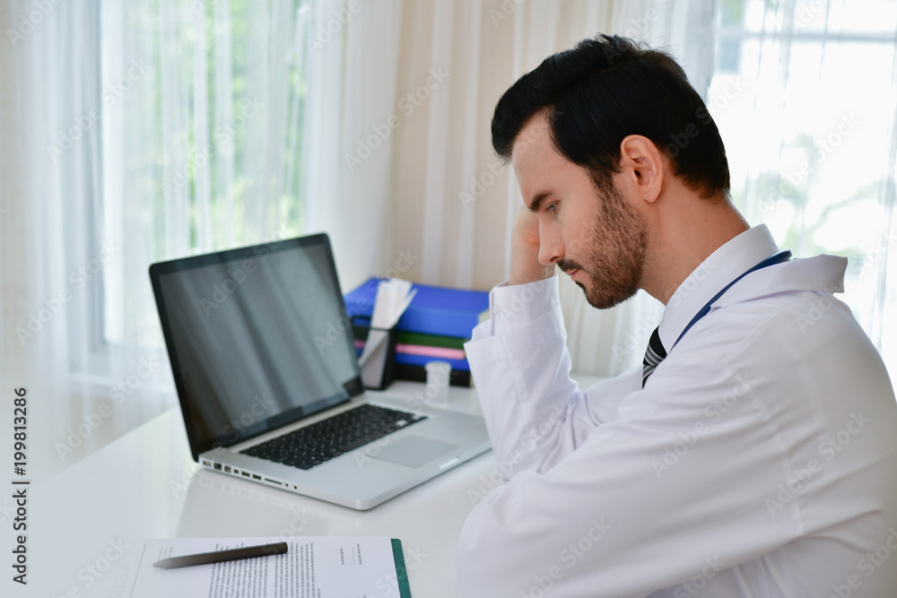 Doctor Concept. Doctors are making serious faces. The doctor is stressed about work. The doctor is feeling a headache at work. The doctor is feeling stressed in treating the patient. Doctor Concept. Doctors are making serious faces. The doctor is stressed about work. The doctor is feeling a headache at work. The doctor is feeling stressed in treating the patient.