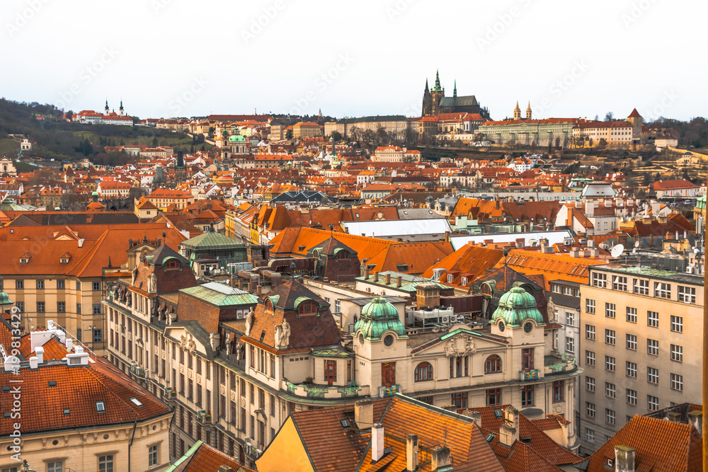 Obraz premium Panorama of the city of Prague. The old part of the city. Beautiful roofs of shingles. Ancient buildings and churches.