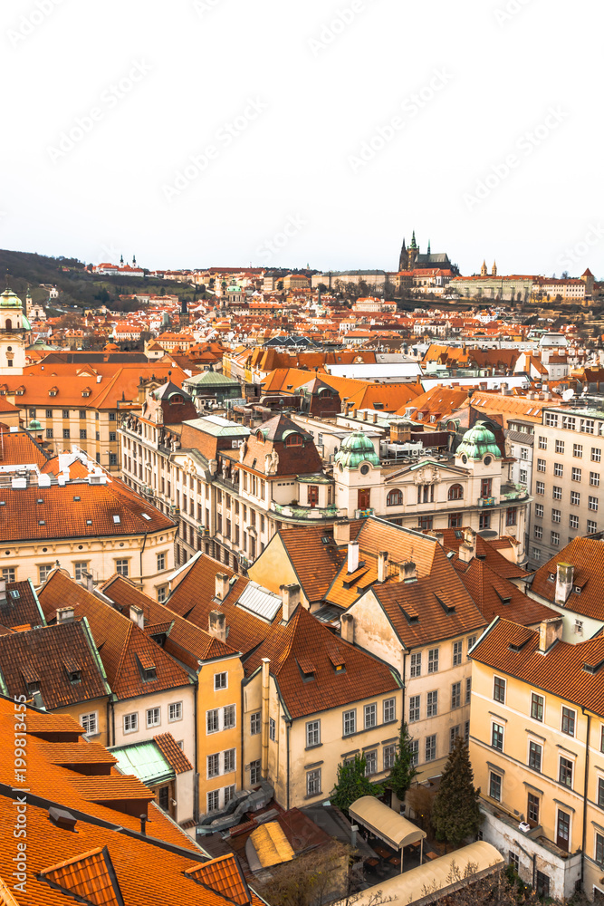 Panorama of the city of Prague. The old part of the city. Beautiful roofs of shingles. Ancient buildings and churches. Panorama of the city of Prague. The old part of the city. Beautiful roofs of shingles. Ancient buildings and churches.