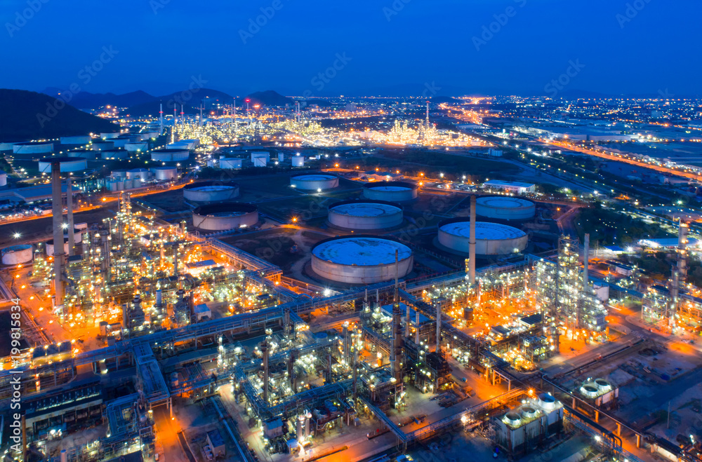 Aerial view of twilight of oil refinery ,Shot from drone of Oil refinery and Petrochemical plant at dusk , Bangkok, Thailand.