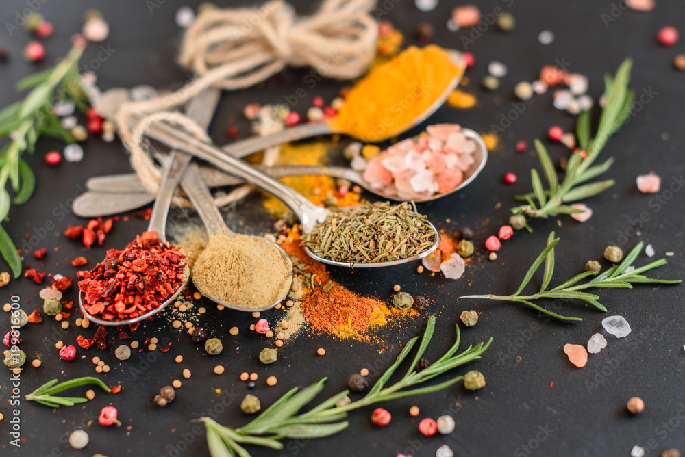 Various spices against a dark background. Food ingredients