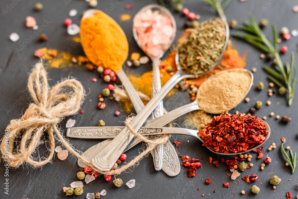 Various spices against a dark background. Food ingredients