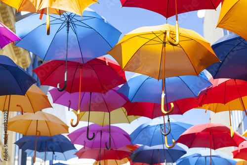 Colorful umbrellas hanging in the air © vladislavmavrin