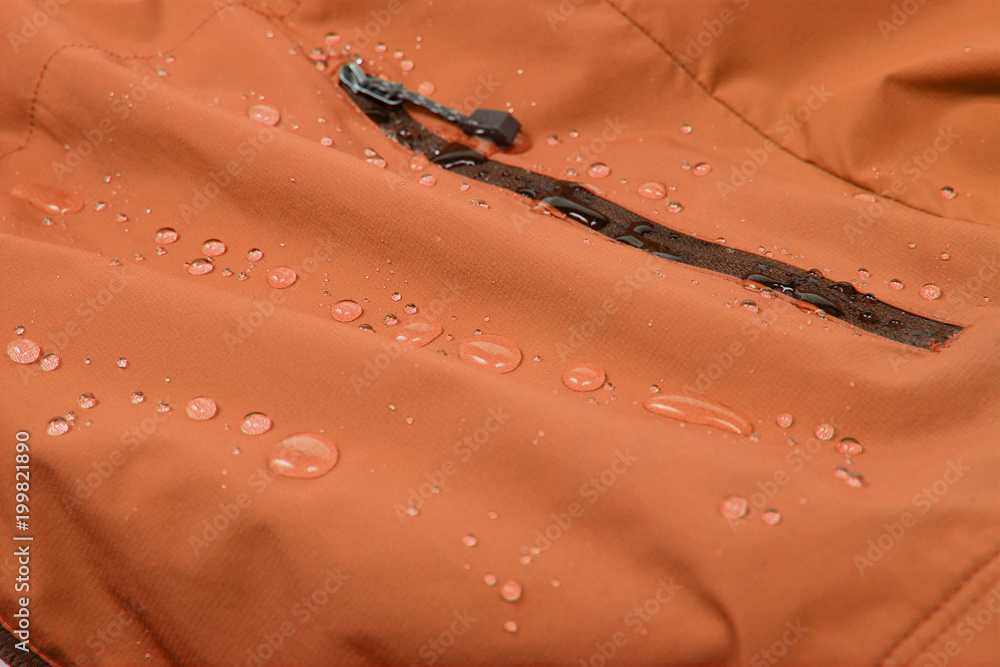 Water repellent coating durable repellency fabric outdoor shell jacket with water drops. Waterproof membrane with droplets.